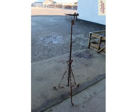 A wrought iron and brass mounted telescopic oil lamp stand 