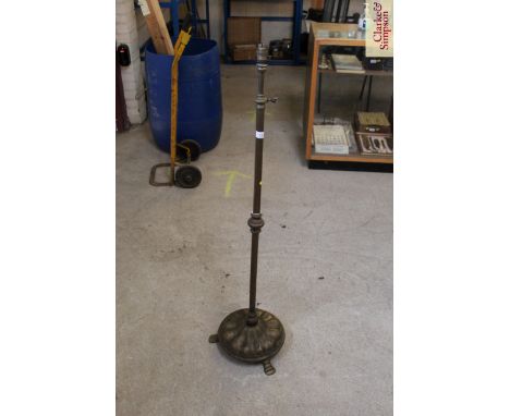 A brass adjustable standard lamp