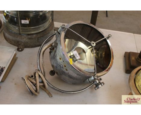 A chrome Francis search light