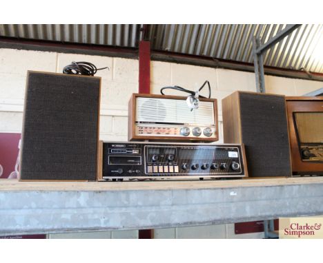 A Hitachi 8 Track recorder stereo and a standard Hi Fidelity three band transistor radio and pair of speakers