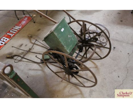 A large vintage coulter planter with wooden seed box