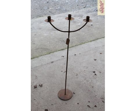 An iron three light candle stand 