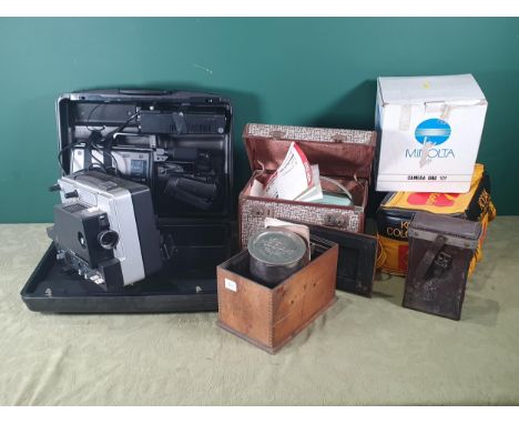 A Zeiss Ikon Movilux R Projector, a Panasonic VHS Movie Camera, a Projector and various cases, a Kodak Developing Tank in ori