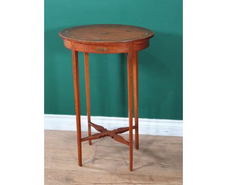 An Edwardian small satinwood Occasional Table, the oval top painted musical instruments and flowers on fine squared tapering 