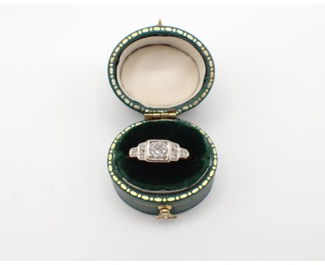 An Art Deco Diamond Ring pavé-set brilliant-cut stones between trios of eight-cut stones, stamped 18ct, approx 3.48gms, ring 