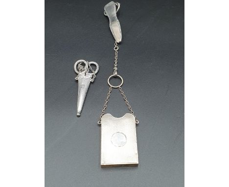 A George V silver Chatelaine with engine-turned note-pad holder, Birmingham 1910, and a pair of Scissors in case, Birmingham 