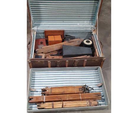 A case containing a selection of dark room equipment, folding camera stands, a Cardinal Ruby Lamp, etc 