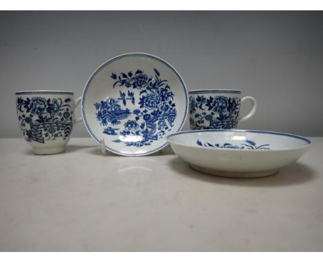 A pair of early Worcester blue and white Cups and Saucers with fence pattern, crescent mark 