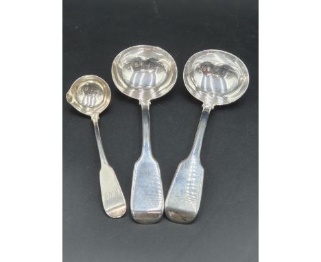 A pair of Victorian silver Sauce Ladles fiddle pattern, London 1859, and an Irish Toddy Ladle fiddle pattern engraved initial