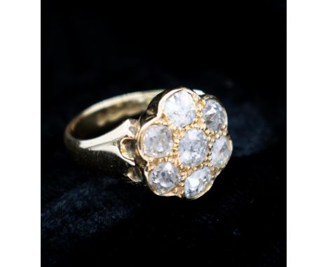 A Diamond flowerhead Cluster Ring pavé-set seven old-cut stones in 18ct gold ring size K, approx 7.70gms 