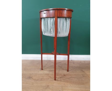 A 19th Century Sheraton style satinwood oval Sewing Table with hinged lid raised upon fine square cut legs united by X-stretc