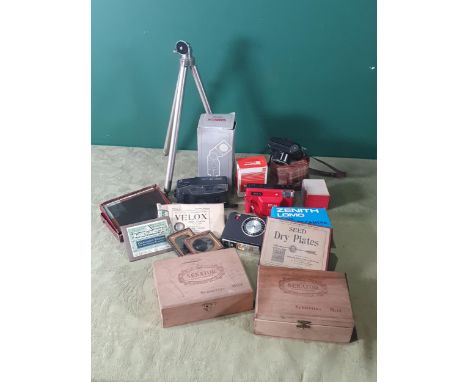 A box of Camera Equipment including magazine, view finders, flash, microscope dry plates, a tripod, etc 