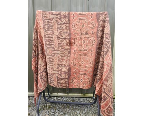 Two Indonesian (Sumba) textiles. Hinggi (man’s cloak). Hand spun cotton using Ikat technique with multiple animal and tree im
