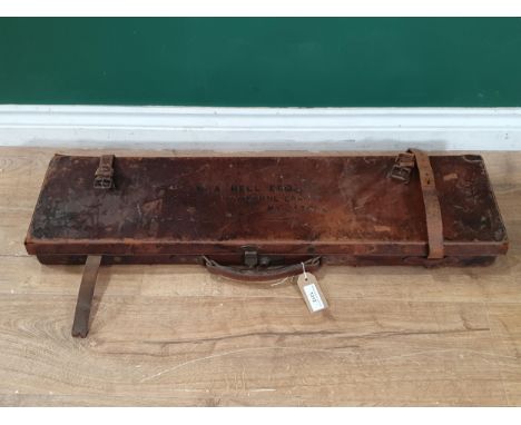 An antique leather fitted Gun Case with green baise interior and Army and Navy paper label inside lid 2ft 9in L x 9in W 