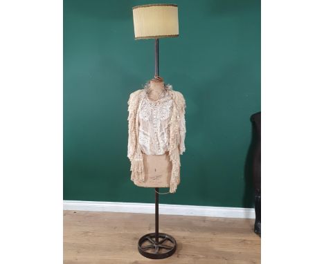 An antique ladies Dressmaker's Mannequin converted into a standard lamp with shade, marked Buste Girard, Paris and R.D. Frank