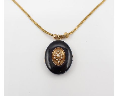 A Victorian black enamel oval Locket the front with central panel set cluster of seed pearls, 28mm x 36mm, on adjustable gold