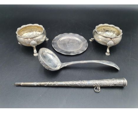 A pair of Georgian silver Cauldron Salts on hoof feet, marks worn, a Sifting Ladle, fiddle, thread and shell pattern, London 