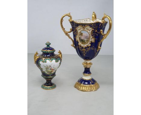 A Coalport three handled Goblet with rich blue ground and reserves of landscapes framed within gilt scrollwork 9in H, and a R