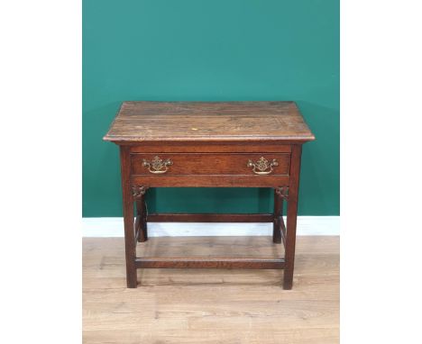 An 18th Century oak Side Table with moulded top fitted frieze drawer above pierced corner brackets raised on moulded and cham