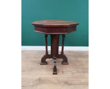A Victorian oak Gothic design octagonal Occasional Table on cluster supports and arched feet, with ivorine maker's disc for '