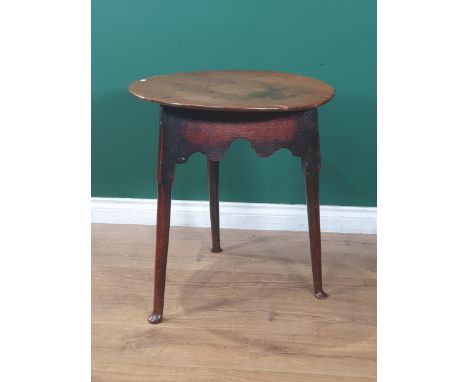 An 18th Century oak and ash Cricket Table with shaped friezes and turned supports, 2ft diam 