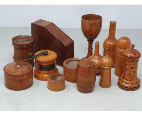 A collection of assorted treen Containers including a boxwood Glove Powderer, a treen domed top Sifter/Muffineer, a fruit woo