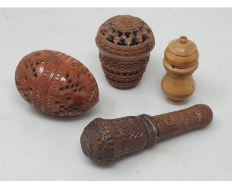Two carved coquila Nuts, a carved treen Case enclosing corkscrew A/F, and another turned nut lidded Container 