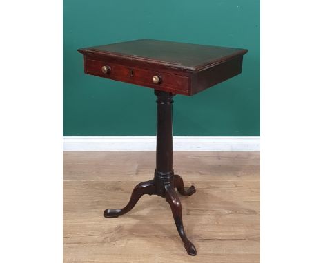 A 19th Century mahogany Reading Table with adjustable top and fitted drawer, the turned column having adjustable height on tr