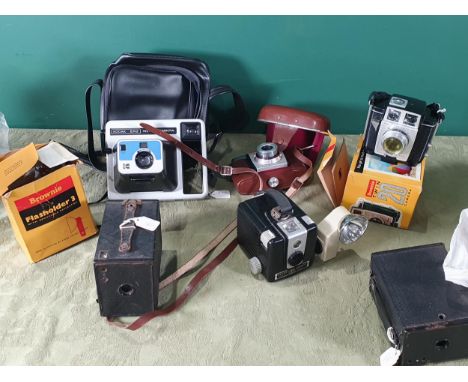 A quantity of Box Brownie Cameras, an Instant Camera, and others 