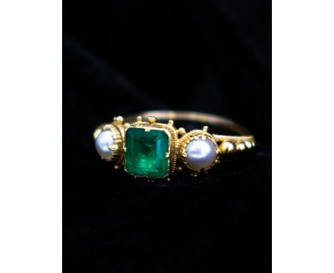 A Georgian Emerald and Pearl Ring close-set step-cut emerald between two pearls in beaded setting, unmarked, untested, ring s