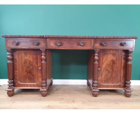 A William IV mahogany Breakfront Pedestal Sideboard, fitted three drawers above two cupboards flanked by reeded columns, 6ft 