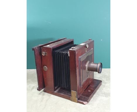 A mahogany 8 x 8in mahogany and brass mounted large format Camera with indistinctly signed lens, the camera labelled W. Watso