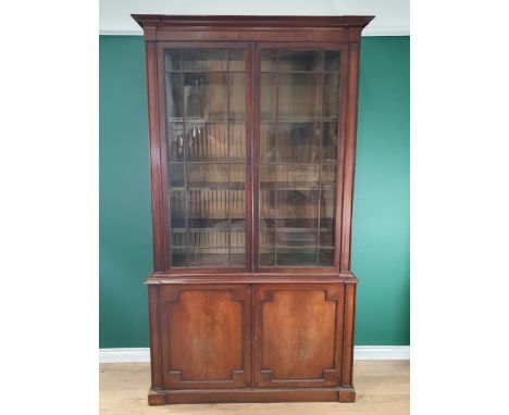 A 19th Century mahogany Glazed Bookcase, the moulded cornice, above pair of glazed doors enclosing three adjustable shelves, 