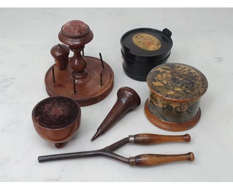 A treen 'Clark and Co's Anchor Sewing Cottons' Thread Dispenser, a treen 'The M.E.Q.' six Cord Dispenser, a machline ware 'Bo