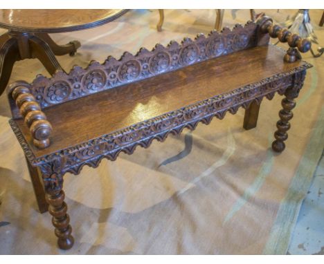 HALL BENCH, Victorian gothic, oak with turned bolster handles, carved rosette back, 127cm W.