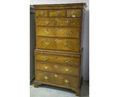 CHEST ON CHEST, George II walnut with three short over six long featherbanded drawers and a brushing slide on bracket feet, 1