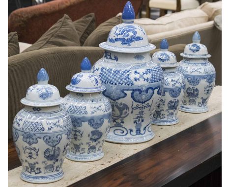 URNS, a series of five, ginger jar vase form Chinese blue and white ceramic with lids, largest 44cm H, others 33cm H. (5)