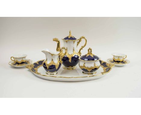 CONTINENTAL CERAMIC CABARET SET, blue, white and gilt, comprising tray, coffee pot, milk jug, sucrier, two cups and saucers, 