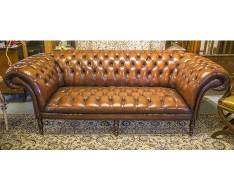 CHESTERFIELD SOFA, traditional hand finished button upholstered leaf brown leather with deeply curved back and arms and turne