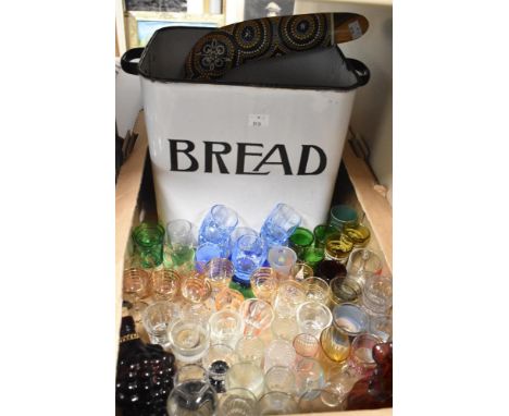 A vintage enamel bread bin sadly missing the lid sold along with a large collection of shot/spirit glasses and a boomerang