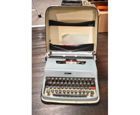 A vintage Olivetti Lettera 32 portable typewriter in carry case