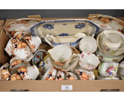 A Wellington China part tea service having autumnal floral decoration in oranges and brown (40), a similar part tea service h
