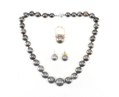 A demi parure of south sea pearl jewellery. The set to include an 18ct yellow gold ring having a central south sea pearl surr