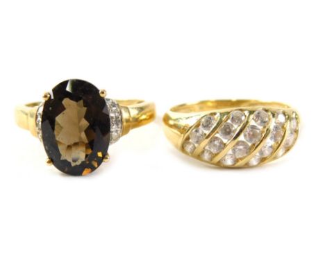 Two 9ct gold dress rings,  comprising a smoky quartz and CZ cluster ring, ring size S½, a five row CZ panel ring, ring size S