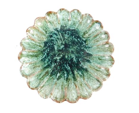 A Linthorpe pottery dish, with Christopher Dresser and Henry Tooth signature mark, no.435, formed as a flower in turquoise an