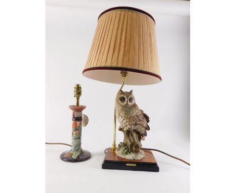 A Moorcroft tube line ceramic lamp base, decorated with flowers in shades of red, orange, purple, blue, etc., and a Guiseppe 