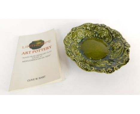A Linthorpe pottery dish, raised with flowers in green glazes, No 1885, impressed marks beneath and Hart (Clive W) Linthorpe 