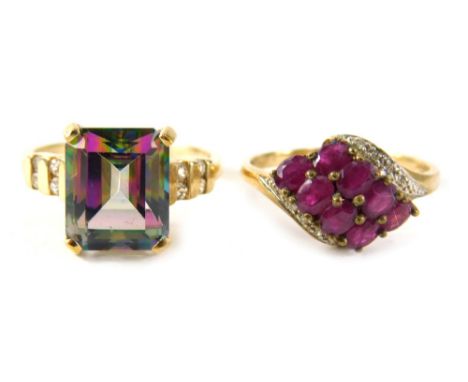 Two 9ct gold dress rings, comprising a garnet and cz twist ring, ring size S and a mystic topaz basket setting ring, ring siz