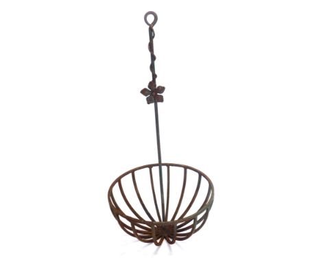 An iron circular feeding trough, with spoked circular centre, on turned floral stem, 112cm high.