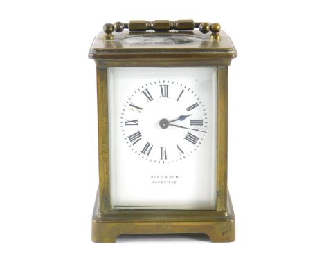 A 20thC Reed &amp; Sons carriage clock, in five part glazed brass case with swing handle, 6cm back plate with Roman numeric d
